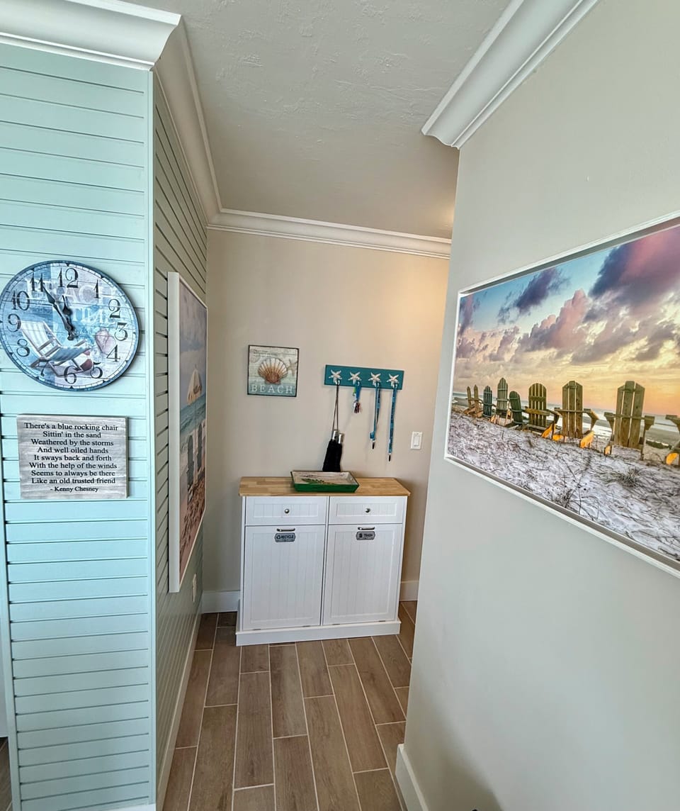 Entry way with garbage and recycling cans.