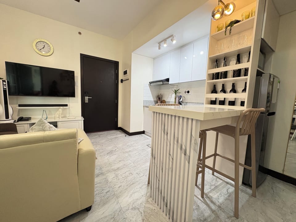 Entry Door from Living Room with TV
