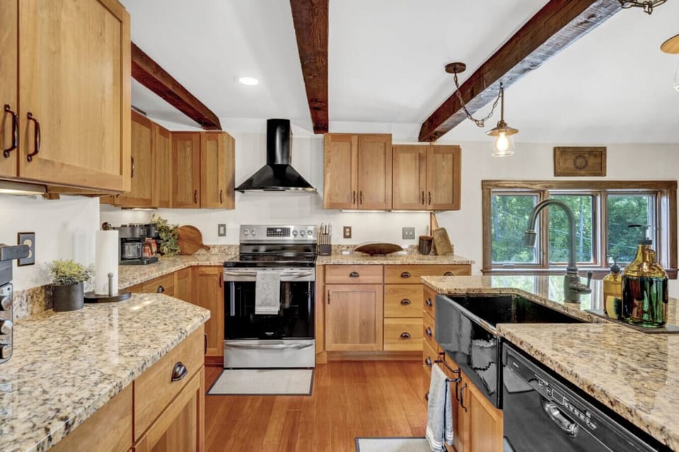 Large, open kitchen with granite countertops and all the essentials to cook for the whole family
