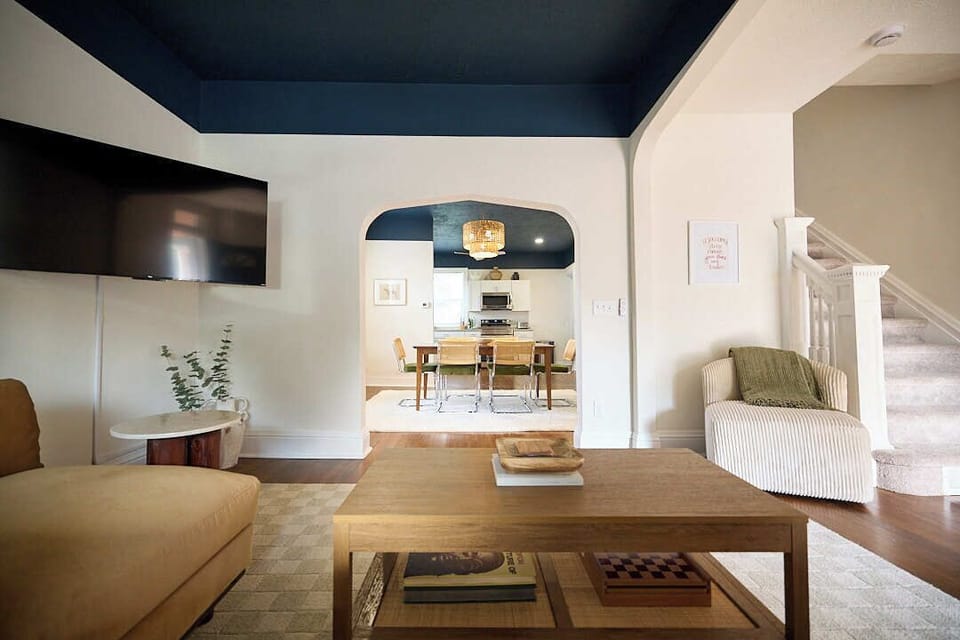 Open arched view to dining room, high ceilings