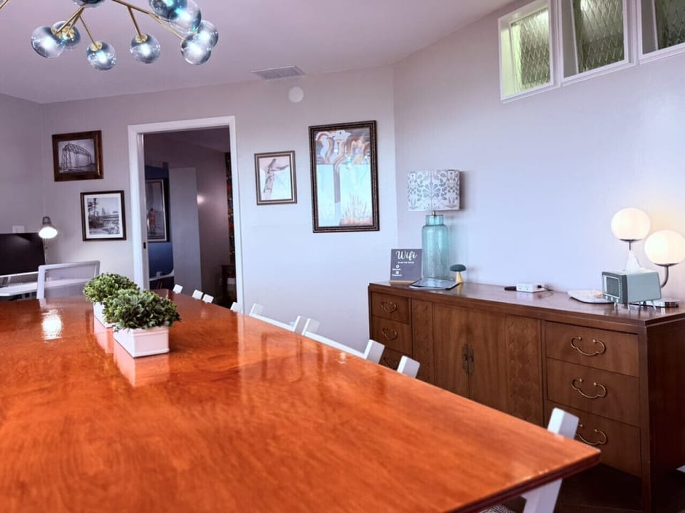 Enjoy dinner at a table that seats ten, then lift off the top and play shuffleboard.