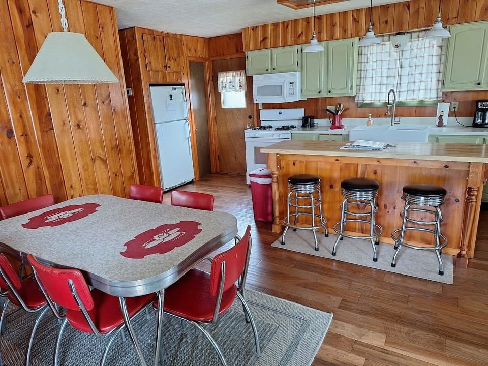 Kitchen and dining area have full size refrigerator plus a beverage fridge.