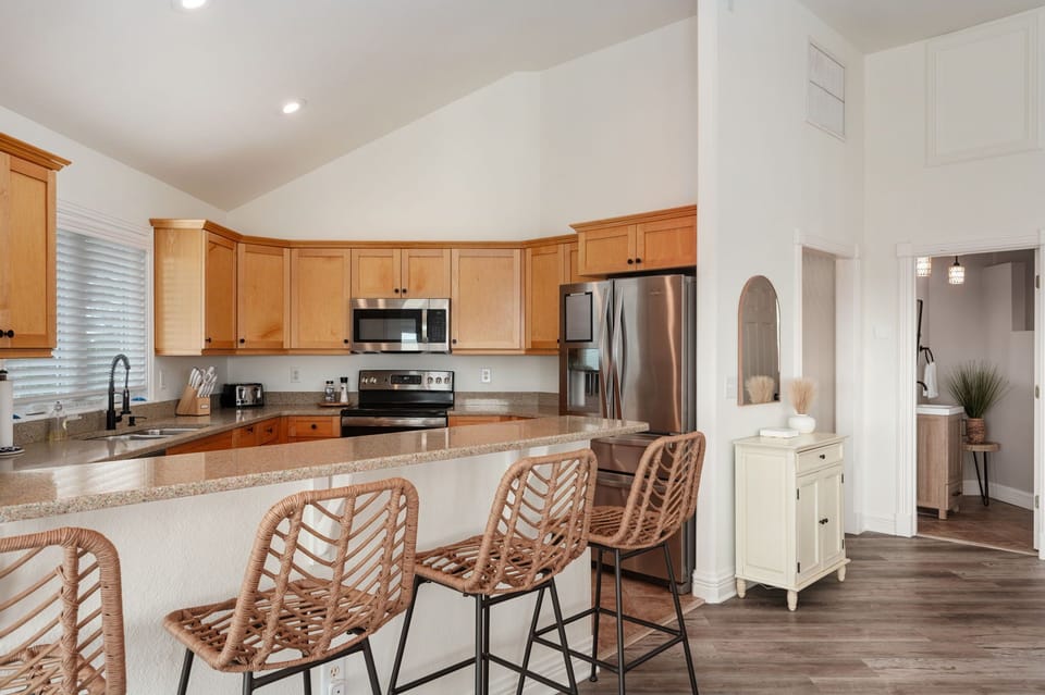 Breakfast Bar and Kitchen with Stainless Steel appliances