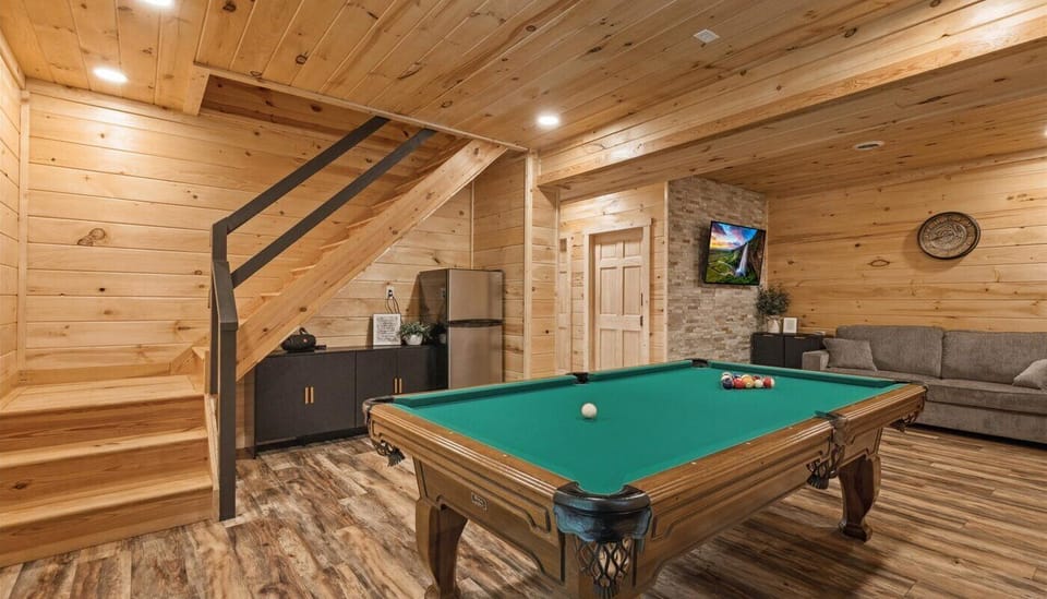 Come and play or just hang out in this entertainment space! Our game room boasts a full pool table, a head to head sit down arcade table with over 400 games, smart TV, additional refrigerator, Queen sleeper sofa.