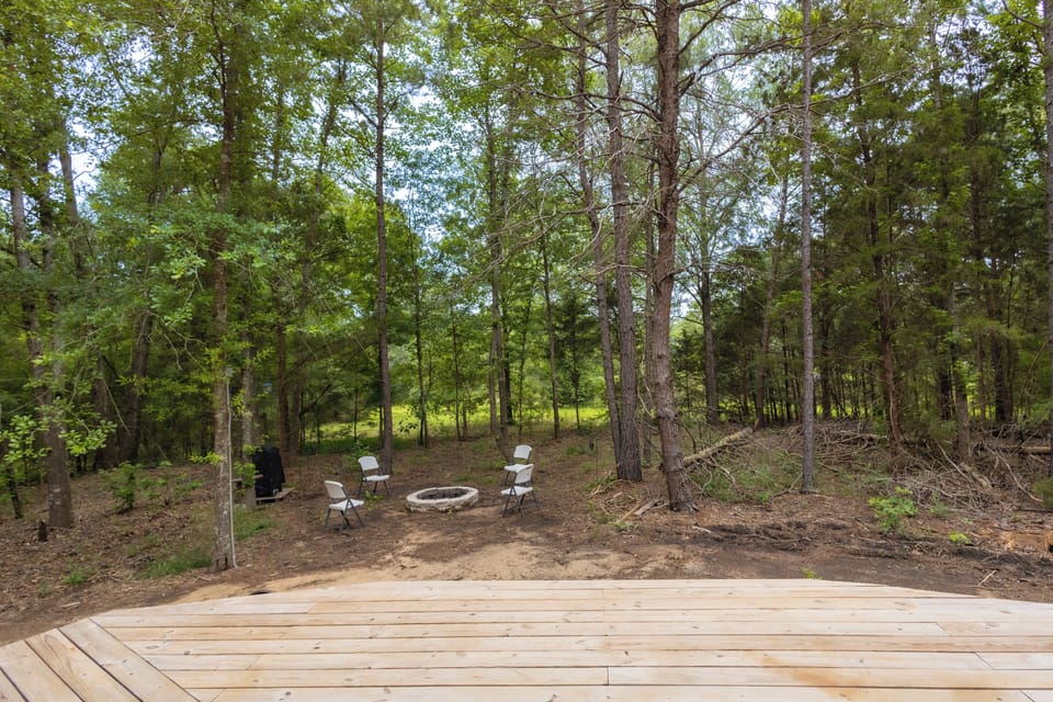 Expansive deck overlooking firepit and neighbors huge pond, chairs being replaced soon just wanted to get her listed ASAP !