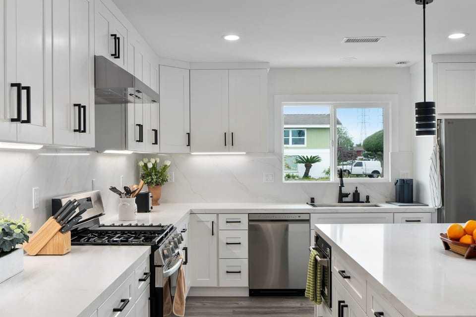 A modern kitchen with all the essentials, from coffee to cookware.