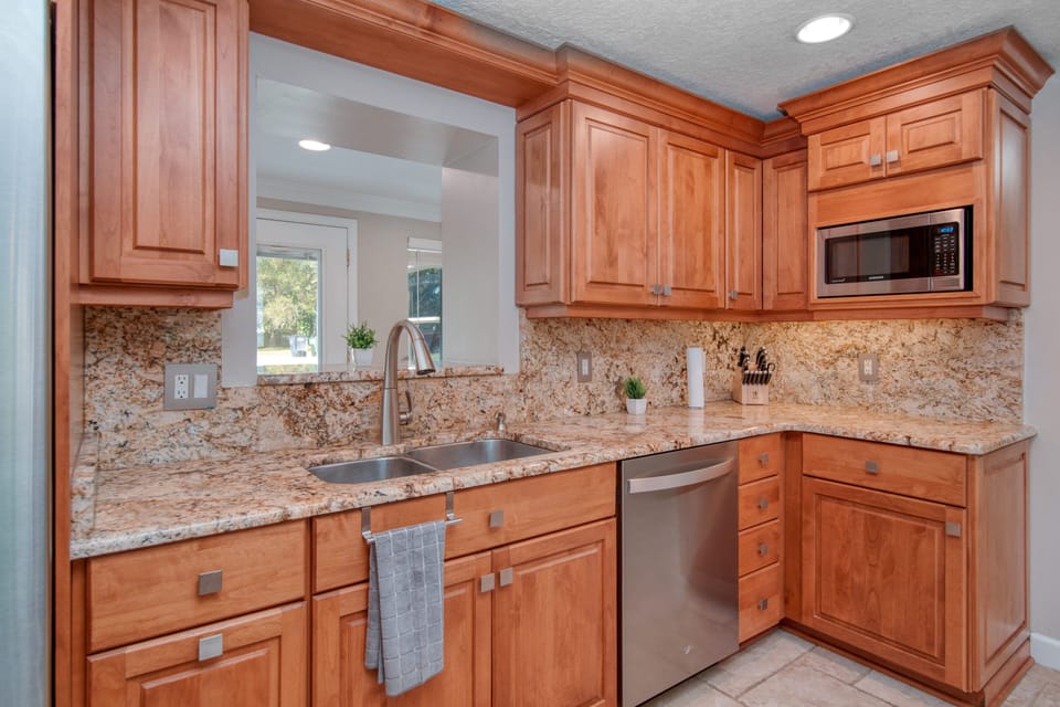 Large stocked kitchen with stainless steel perfect for cooking and meals.
