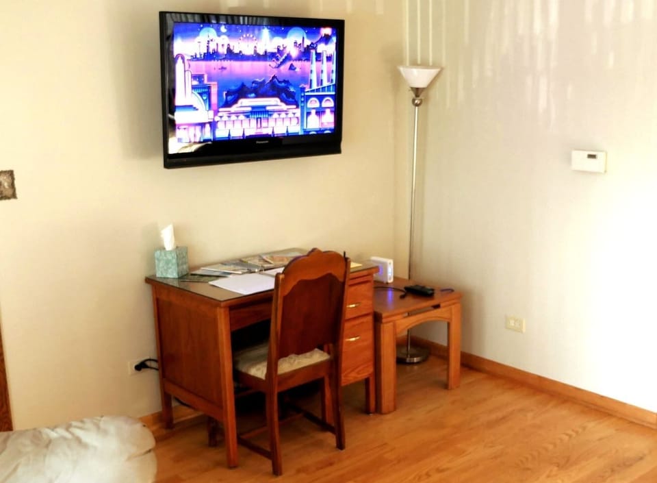 Desk in living room. Roku TV.