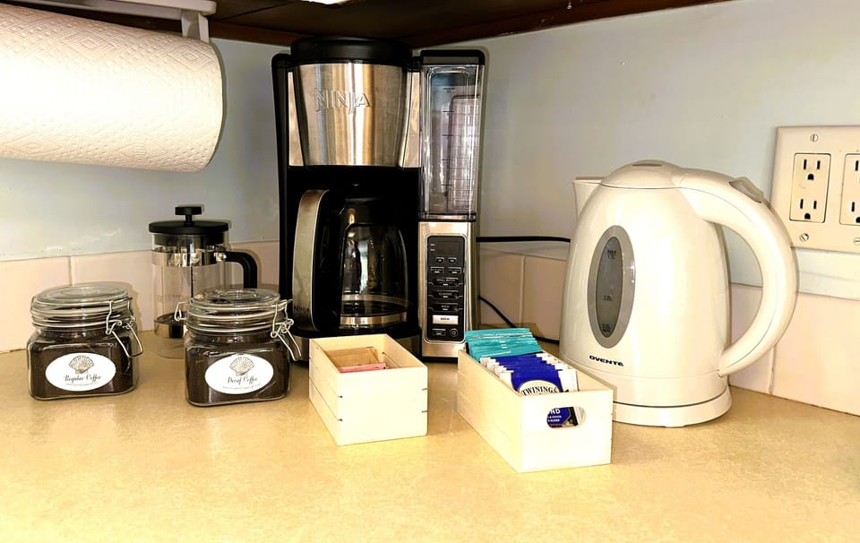 Coffee and tea service with regular and decaf coffee provided, along with a French Press 