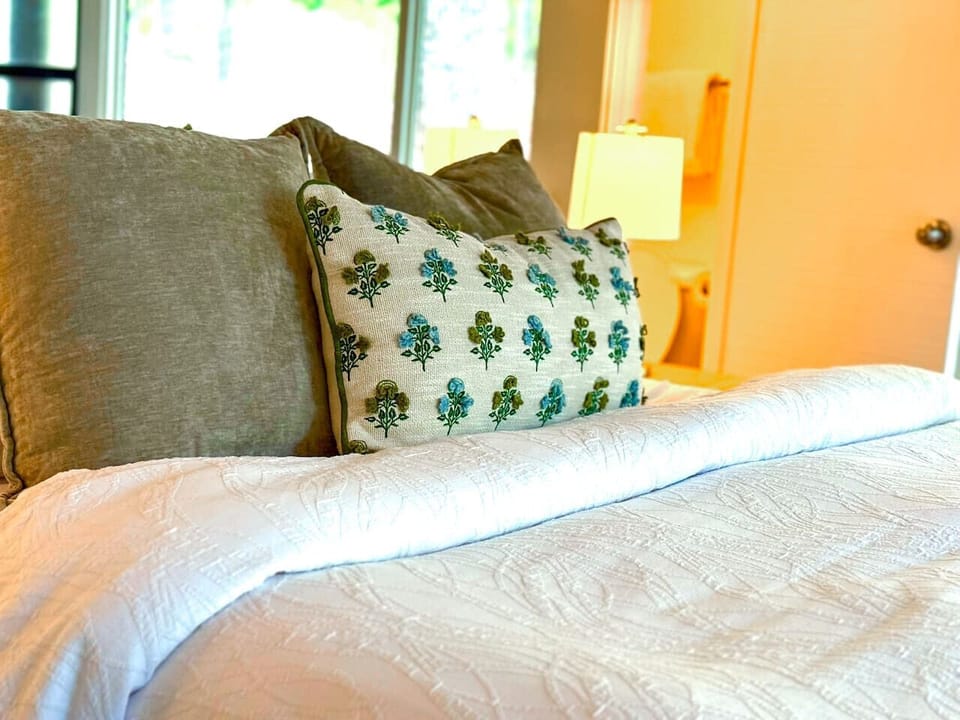 Plush bedding and thoughtful decor create a warm and inviting ambiance.