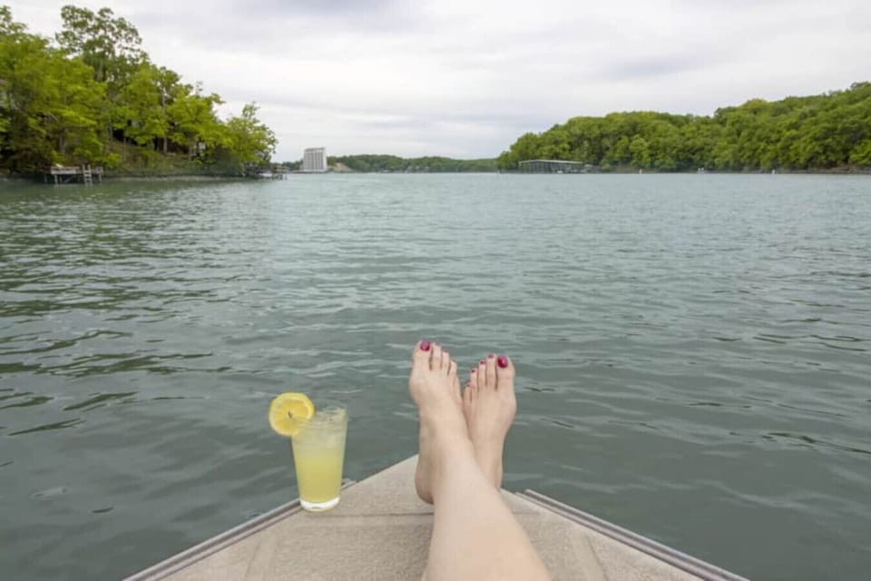 Escape to this tranquil lakefront retreat, offering the perfect spot for relaxing with a refreshing drink and enjoying the serene water views.