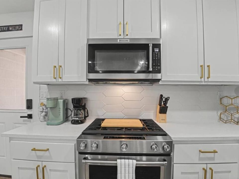 Fully equipped kitchen with stainless appliances and coffee station