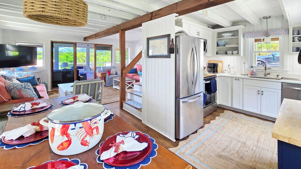 Looking from the dining area towards the kitchen and living room