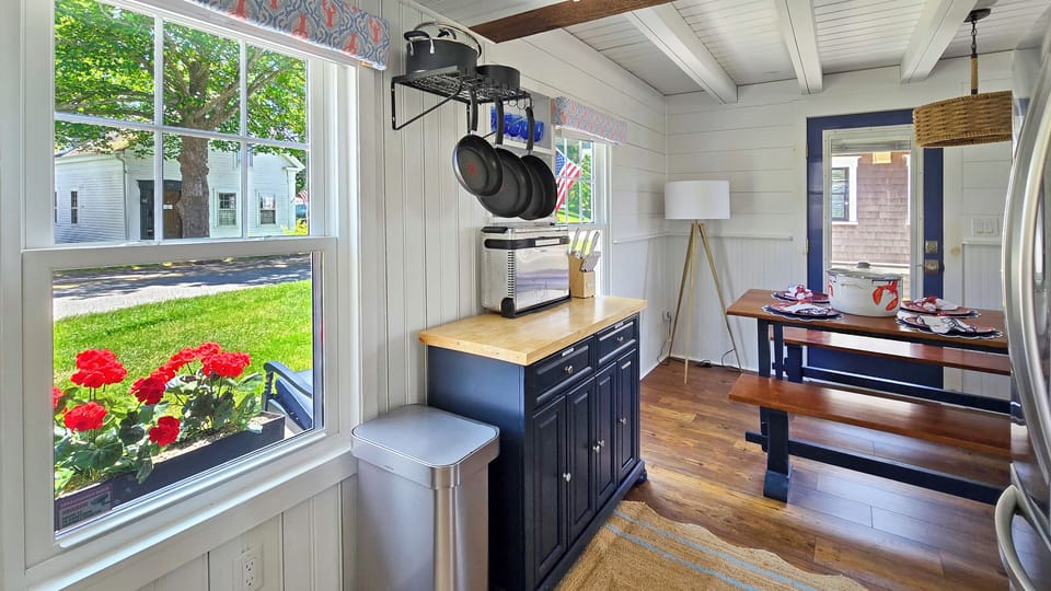 Kitchen opens to the dining area at the front of the cottage