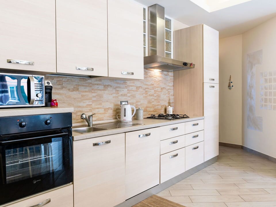 Kitchen, Cabinetry, Countertop, Kitchen Appliance, Major Appliance, Wood, Furniture, Interior Design, Flooring, Cupboard