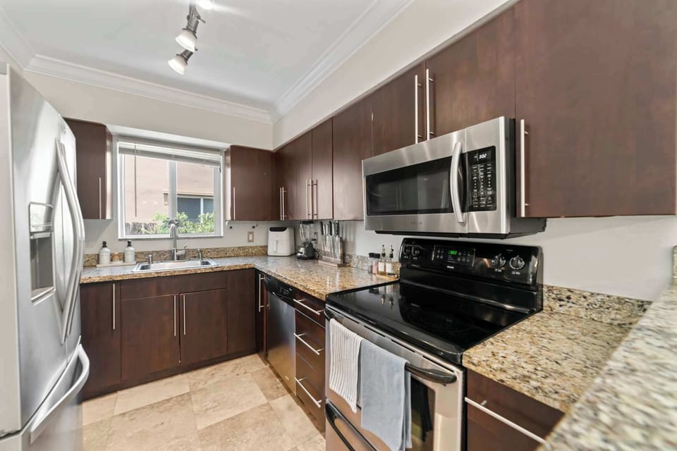 The open kitchen offers ample space & every home comfort