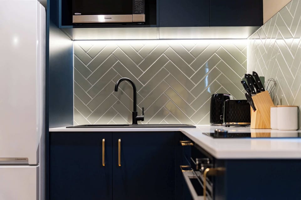 Chic kitchen with bold cabinetry and designer finishes