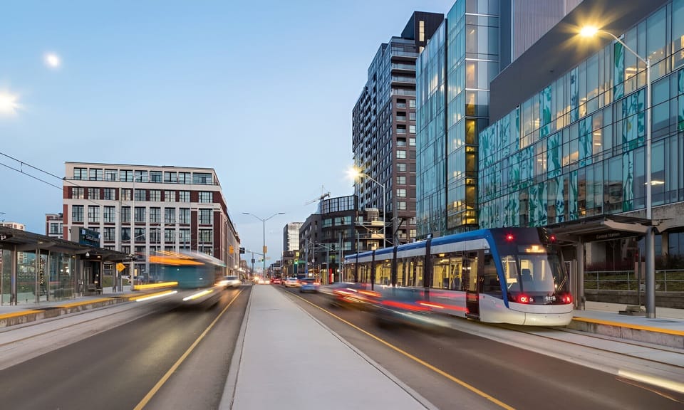 Vibrant Downtown Streetscape With Shops And Transit Just Steps Away