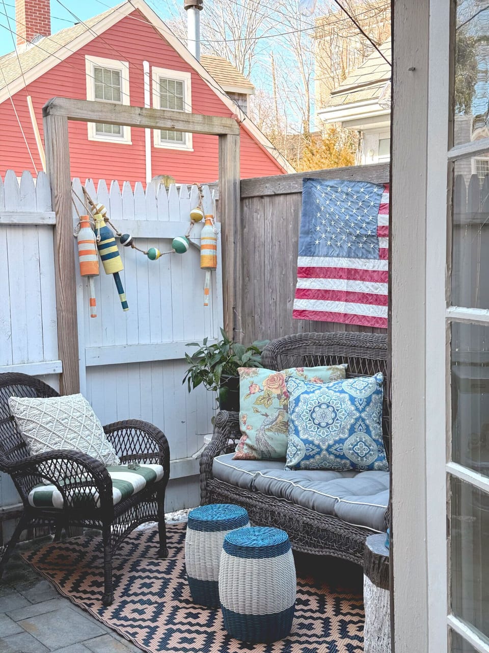 The cozy patio features a BBQ, lounge seating and a table for 4