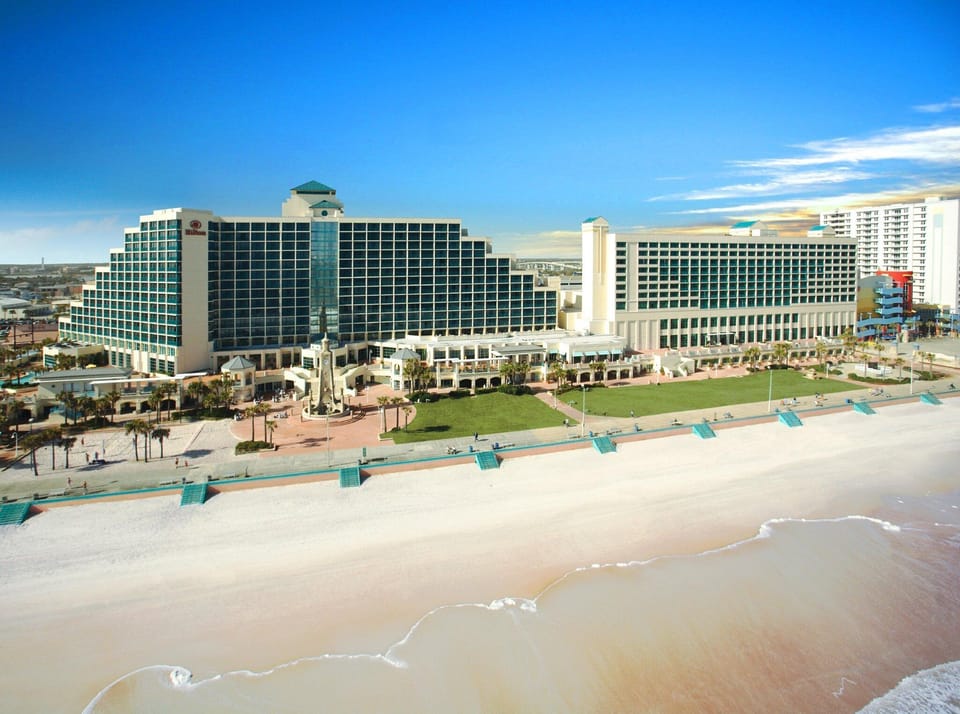 Soak in the beachfront resort panorama steps from sand.