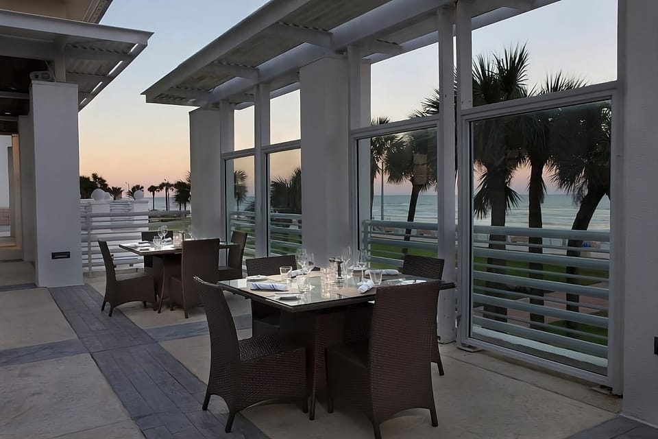 Sip sunset cocktails on the breezy oceanfront terrace dining.