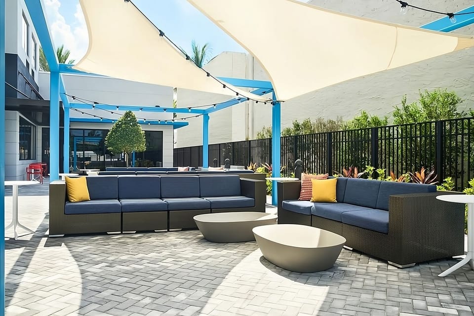Soak up sunshine on shaded patio sofas with breezy comfort.