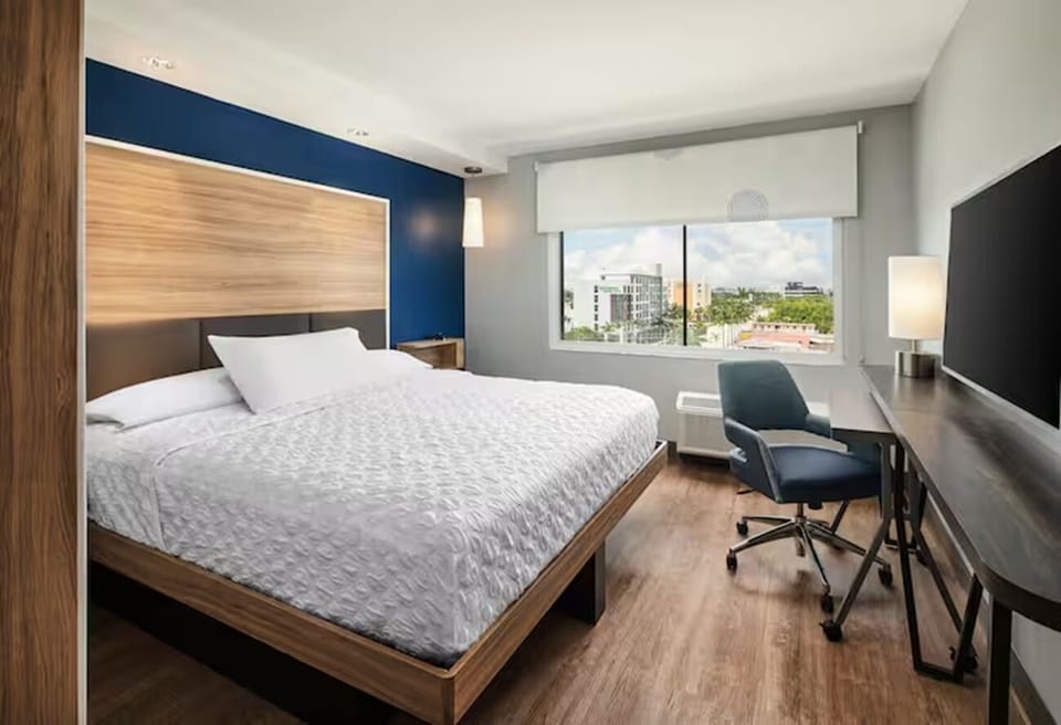 Wake up refreshed beside big windows and a dedicated workspace.