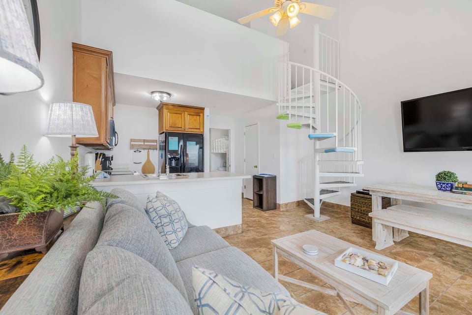 Grand Beach Resort PH2 living room with spiral staircase