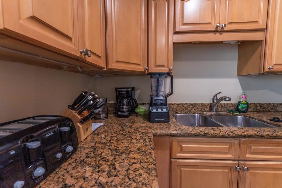 Cook like home with blender, toaster, coffee maker, and full cookware setup.