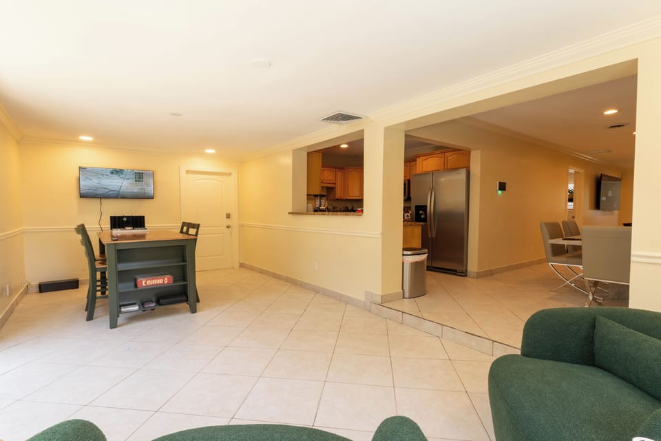 Spacious game area steps from the kitchen—perfect for snacks and play.