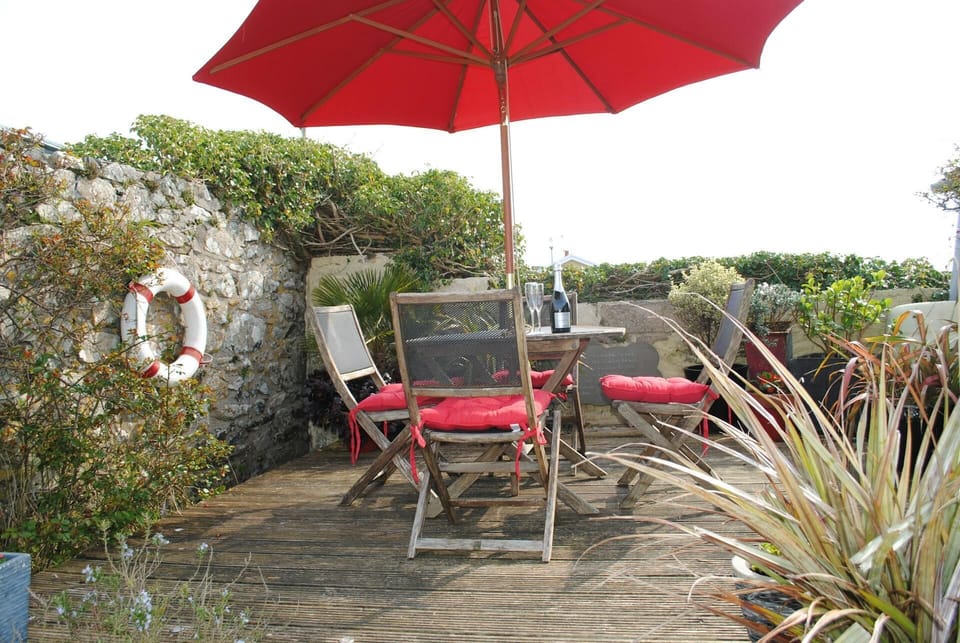 table set located in the garden surrounded by flowers