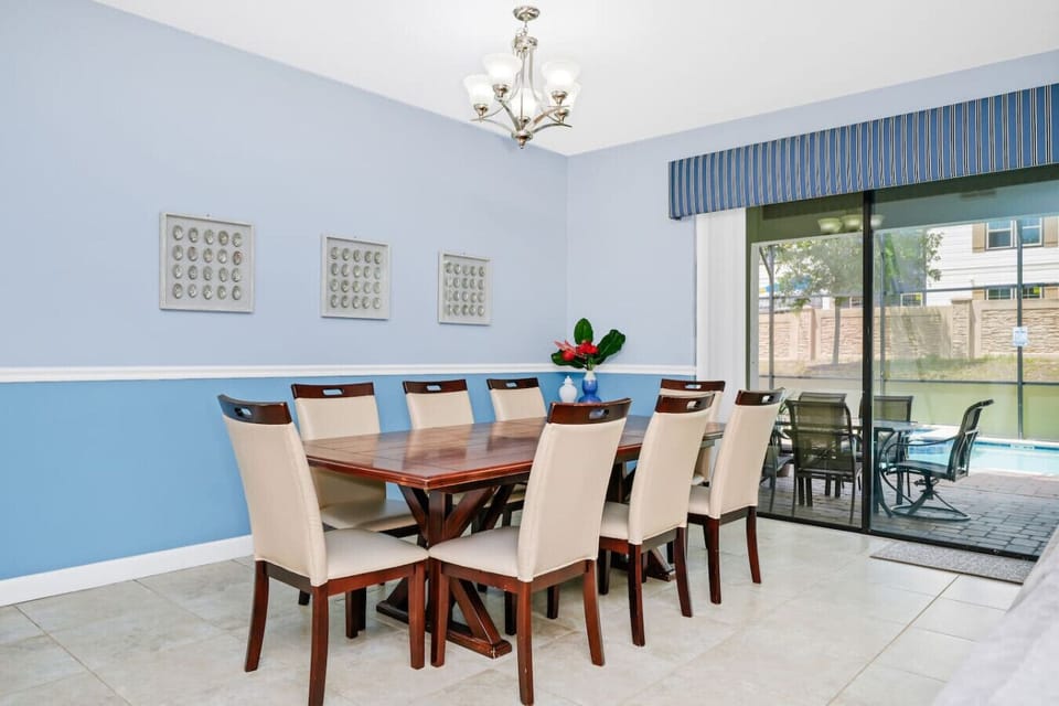 Gather around the spacious dining table, ideal for group meals, celebrations, or game nights.