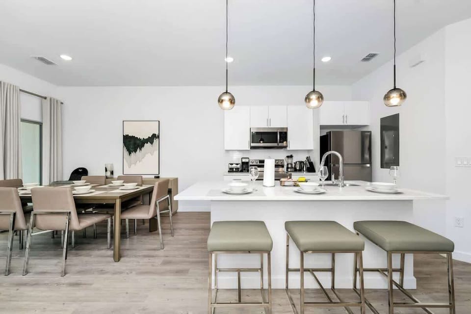 Gather around the spacious dining table, perfect for shared meals and laughs.