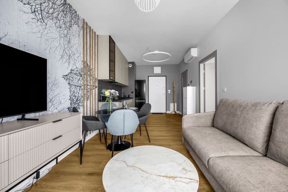 Living Room with Sofa Bed, Smart TV and Dining Table | Book Now with RENTUJEMY.COM