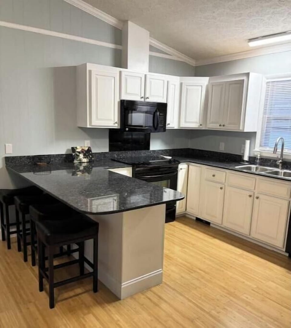 Kitchen has additional 4 bar stools to eat at the bar. Lots of counter space.
