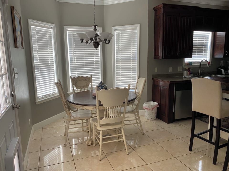 Eat-in breakfast room with bay windows. 