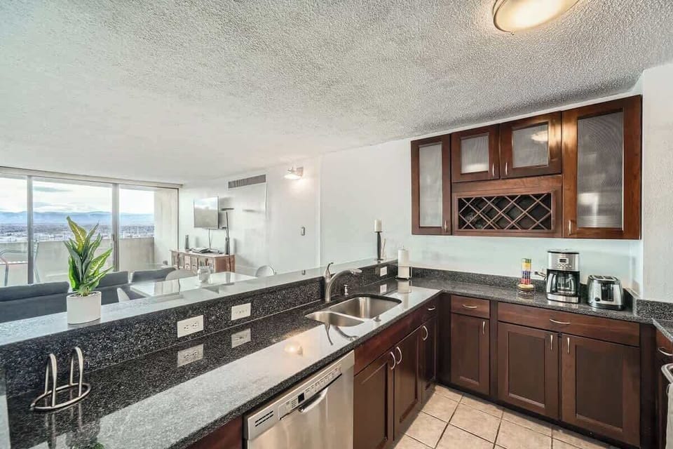 Warm, cozy kitchen featuring wooden cabinets, practical storage, and all essential appliances. A comfortable space perfect for everyday cooking and gathering