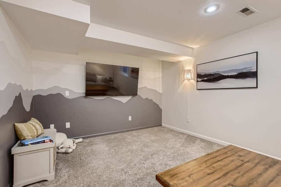 Basement living room with sizable TV