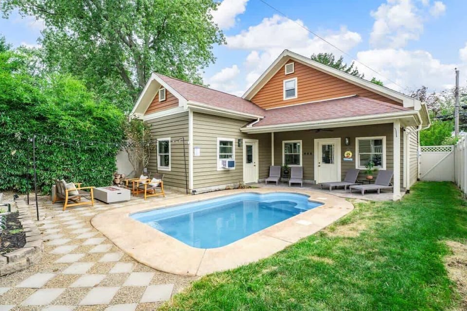 Relax by the private pool beside this charming home, surrounded by greenery & a sunny patio for laid-back afternoons