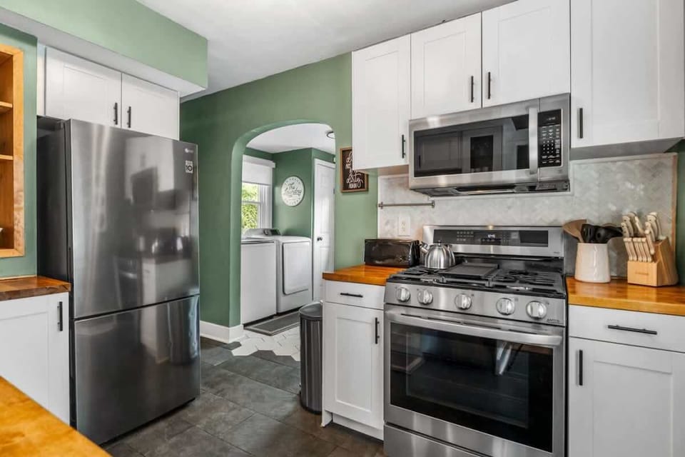 Functional kitchen layout w/ stainless appliances and plenty of space to prep meals
