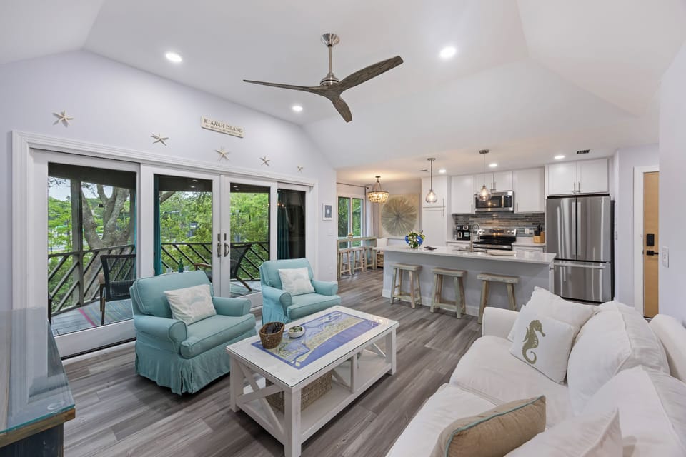 Spacious and cozy living room with flat screen TV