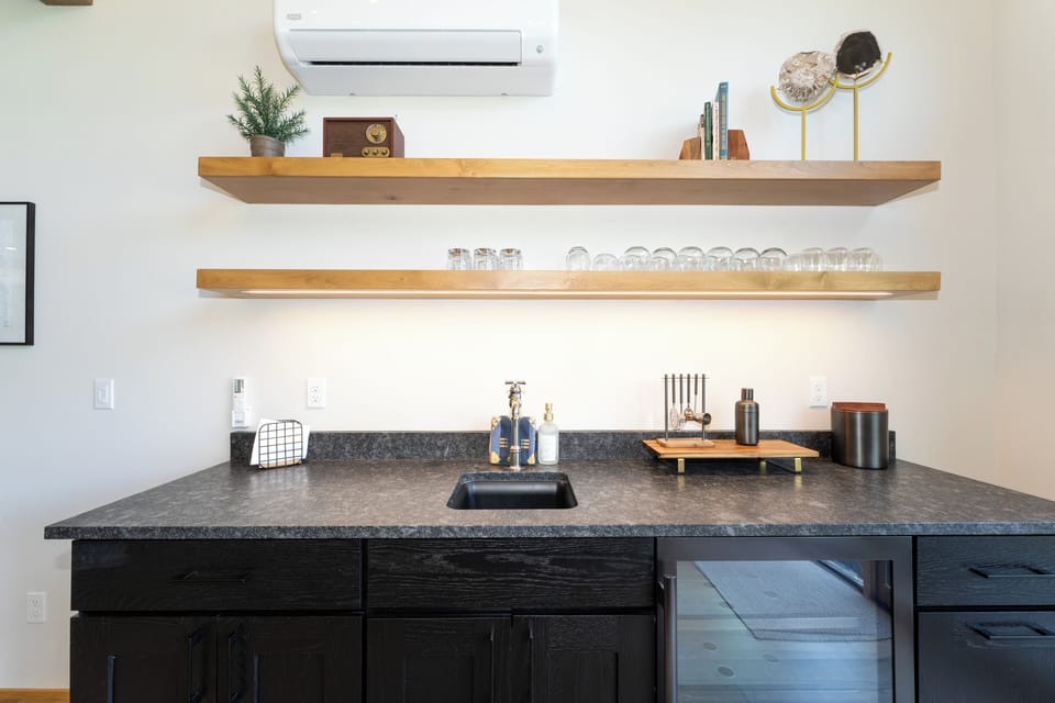 Wet bar behind the living room couch | Main Level