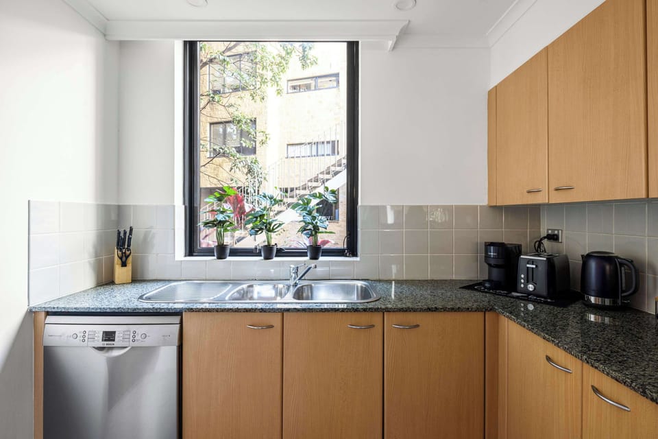Fully equipped kitchen with a modern oven and dishwasher. Cook your favorite meals with ease and enjoy hassle-free cleanup. Includes all essential cookware and utensils for a comfortable stay.