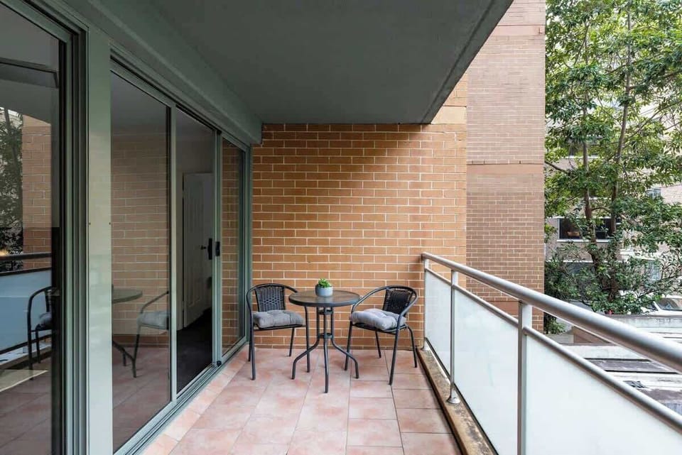 Stretch out and relax on the spacious balcony, featuring a cozy table and chair set — perfect for morning coffee or an evening glass of wine while enjoying the natural breeze.