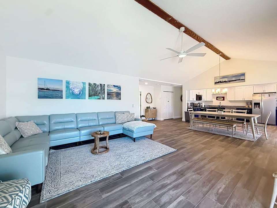 View of living room, dining area and kitchen area.
