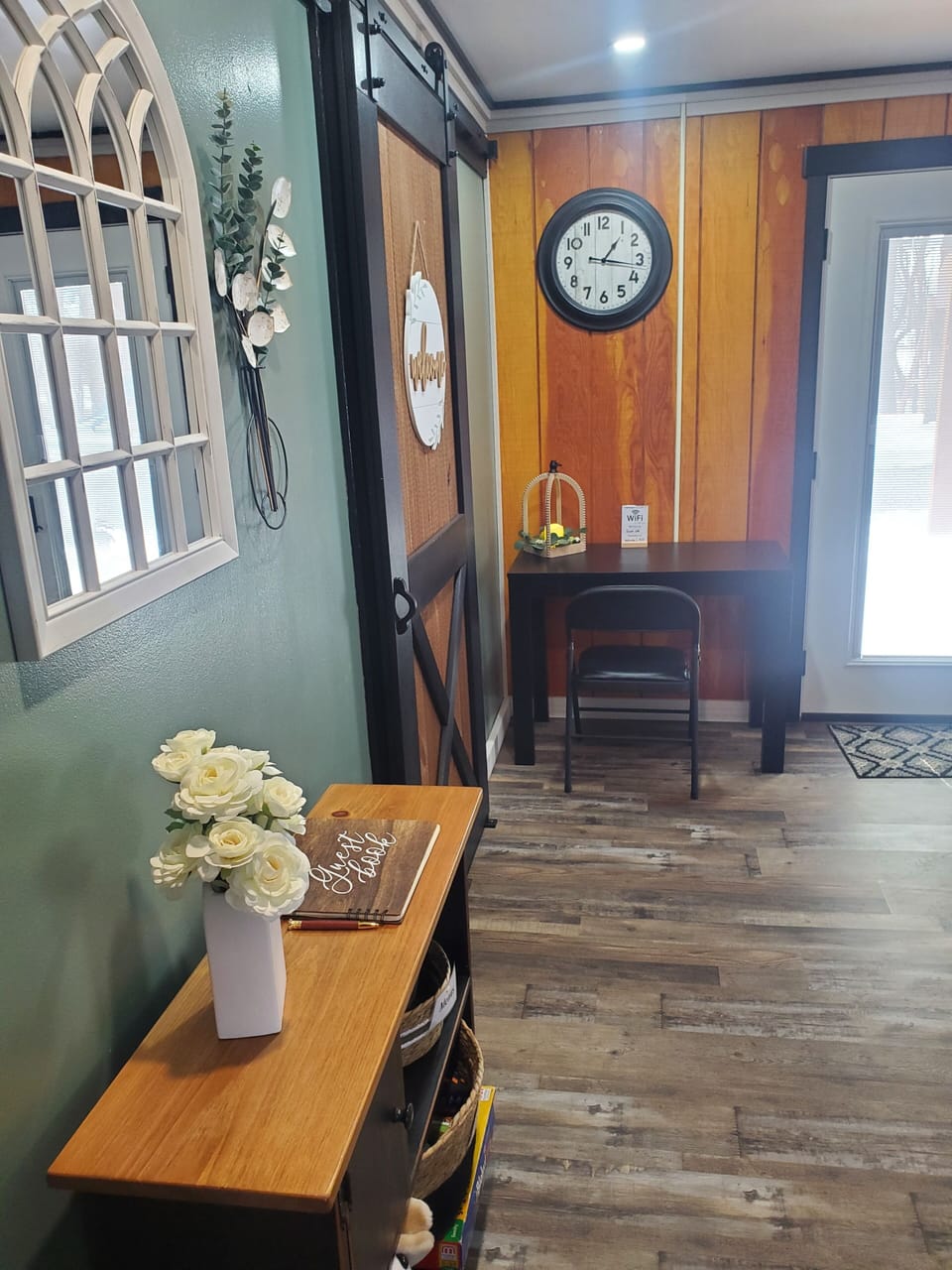desk and chair, cabinet with guest book, local menus, games