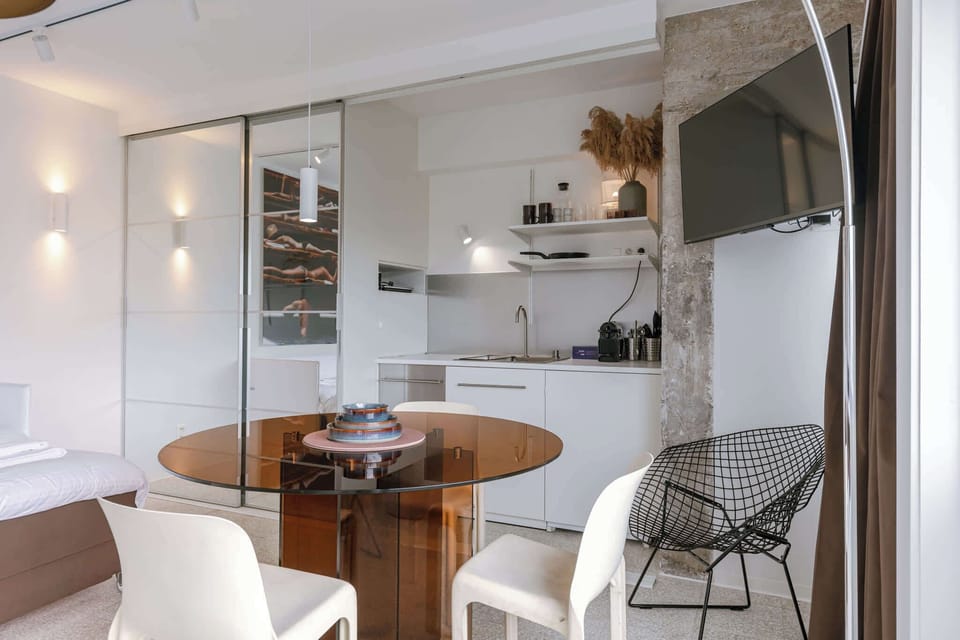 Dining Table Next to Open Kitchen & TV