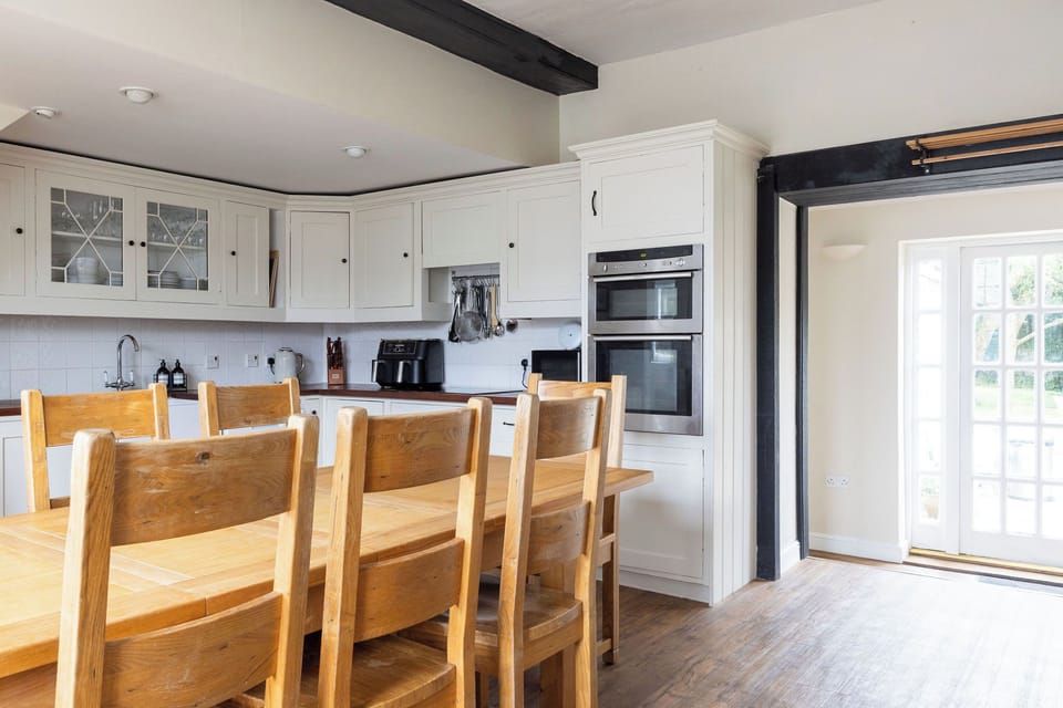Kitchen with dining table and seating 