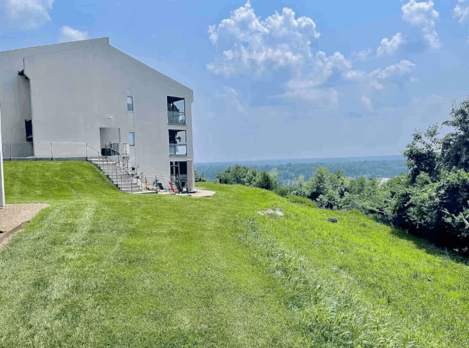Relax and enjoy breathtaking, panoramic views of the Lake of the Ozarks from this hillside studio, a truly serene setting for your getaway.