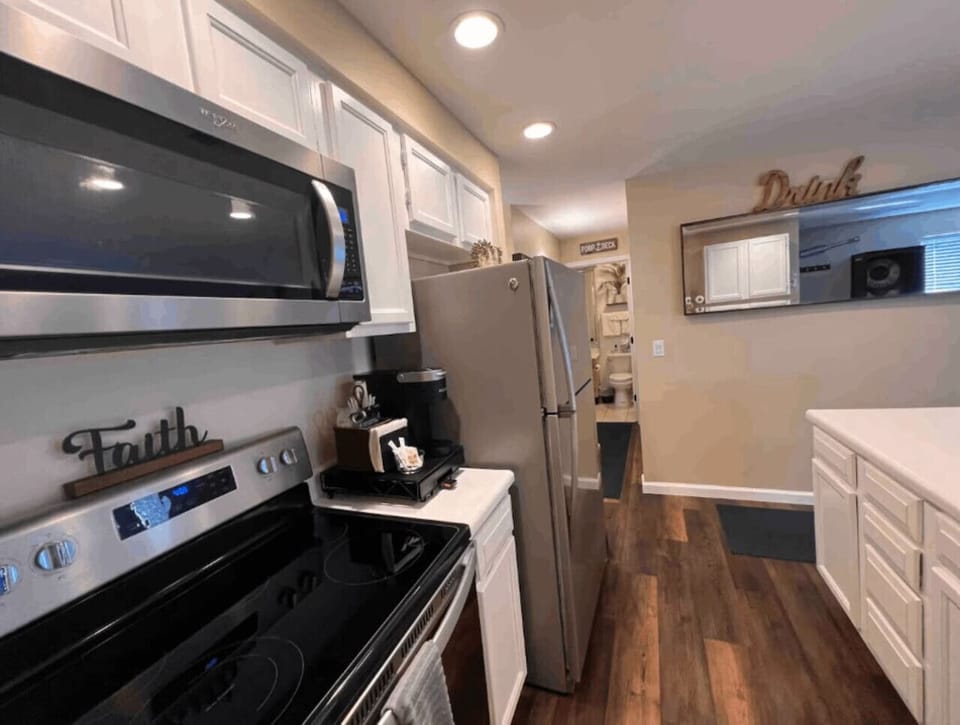 Bright, fully equipped kitchen with a modern stove and plenty of counter space for meal prep.
